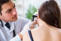 The doctor checking patients ear during medical examination Royalty Free Stock Photo