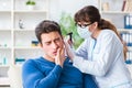 The doctor checking patients ear during medical examination Royalty Free Stock Photo