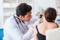 The doctor checking patients ear during medical examination Royalty Free Stock Photo