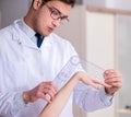 Doctor checking patients joint flexibility Royalty Free Stock Photo