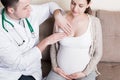 Doctor is checking pregnant woman`s breast Health problems during pregnancy concept Royalty Free Stock Photo