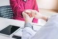 Doctor checking pulse for patients Health care in hospital