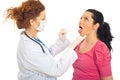 Doctor checking for sore throat Royalty Free Stock Photo