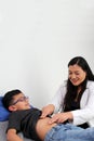 Doctor checks the belly of a child in her office to rule out diseases such as appendicitis, gastroenteritis, hernia or ulcer