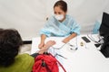 Almaty, Kazakhstan - 08.11.2021 : Doctors check the pressure and temperature before vaccination