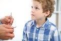 Doctor and child patient. Physician examines little boy by stethoscope. Medicine and children`s therapy concept Royalty Free Stock Photo