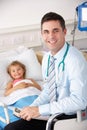 Doctor with child patient in UK