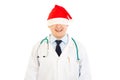 Doctor in Christmas hat stretched over his eyes