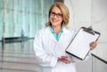 Doctor, clinical practitioner, medical field lab specialist, holding diagnosis results clipboard, blank card template