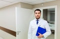 Doctor with clipboard at hospital