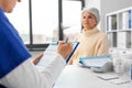 doctor with clipboard and senior woman at hospital Royalty Free Stock Photo