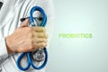 Doctor close-up and inscription probiotics. The concept of diet, intestinal microflora, microorganisms, healthy digestion
