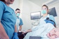 Doctor during colonoscopy in hospital looking at screen Royalty Free Stock Photo