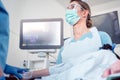 Doctor during colonoscopy in hospital looking at screen Royalty Free Stock Photo