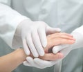 Doctor comforting a sick woman.