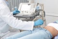 Doctor conducting ultrasound examination of patient`s abdomen Royalty Free Stock Photo