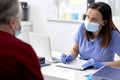 Female doctor conducts a medical interview with the senior Royalty Free Stock Photo