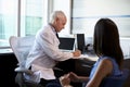 Doctor In Consultation With Female Patient In Office Royalty Free Stock Photo