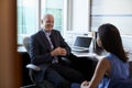 Doctor In Consultation With Female Patient In Office Royalty Free Stock Photo