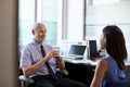 Doctor In Consultation With Female Patient In Office Royalty Free Stock Photo