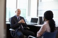 Doctor In Consultation With Female Patient In Office Royalty Free Stock Photo