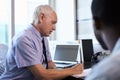 Doctor In Consultation With Male Patient In Office Royalty Free Stock Photo