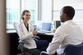 Doctor In Consultation With Male Patient In Office Royalty Free Stock Photo