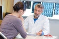 Doctor in consultation with woman grave expression Royalty Free Stock Photo