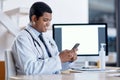 Doctor consulting with an online patient on video call on a phone, doing telemedicine and listening during a medical Royalty Free Stock Photo