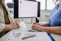 Doctor consulting with overweight patient, discussing test result in doctor office. Concept of health risks of overwight Royalty Free Stock Photo