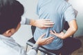 Doctor consulting with patient Back problems Physical therapy co Royalty Free Stock Photo