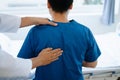 Doctor consulting with patient Back problems Physical therapy concept Royalty Free Stock Photo