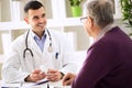 Doctor consulting patient with medicine drugs Royalty Free Stock Photo
