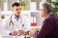 Doctor consulting patient with medicine drugs Royalty Free Stock Photo