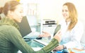 Doctor consulting visitor female in aesthetic medicine center Royalty Free Stock Photo