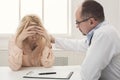 Doctor consulting woman in hospital