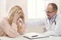 Doctor consulting woman in hospital