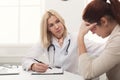 Doctor consulting woman in hospital