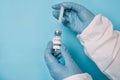 Doctor with Coronavirus Vaccine vial and syringe. Doctor preparing a dose for a patient of the third vaccine for Covid Royalty Free Stock Photo