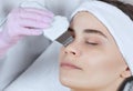 The doctor-cosmetologist makes the apparatus a procedure of ultrasound cleaning of the facial skin Royalty Free Stock Photo
