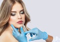 The doctor cosmetologist makes Lip augmentation procedure of a beautiful woman in a beauty salon.Cosmetology skin care