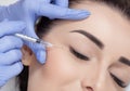 The doctor cosmetologist makes the Rejuvenating facial injections procedure for tightening and smoothing wrinkles on the face