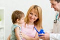 Doctor counseling mother and boy about nasal Royalty Free Stock Photo