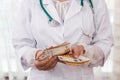 Doctor counting euro banknotes, bribe in medicine Royalty Free Stock Photo