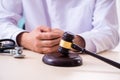 Male doctor in courthouse meeting with lawyer Royalty Free Stock Photo