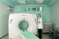 Doctor in CT (CAT) scanner room Royalty Free Stock Photo