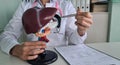 Doctor demonstrates a model of liver at table in a clinic