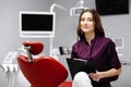 Doctor dentist working in office, using clipboard and making notes Royalty Free Stock Photo