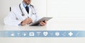 Doctor at desk office write on digital tablet, with symbols and medical icons, web banner and copy space