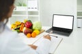 Doctor dietician have online consultation, using laptop